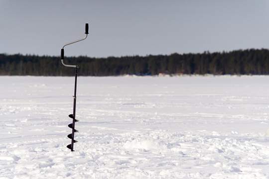 auger drilled into frozen pond